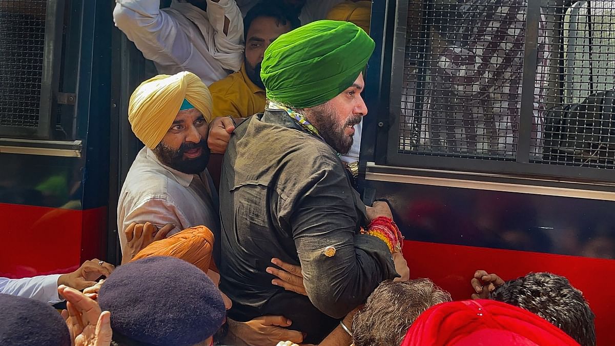 Punjab Congress president Navjot Singh Sidhu was detained by Punjab police while staging a protest outside the Raj Bhavan in Chandigarh. Sidhu along with several party MLAs held a protest demanding the arrest of the son of Union Minister of State for Home Ajay Mishra for his alleged involvement in the Lakhimpur Kheri incident. Credit: Twitter/@INCChandigarh