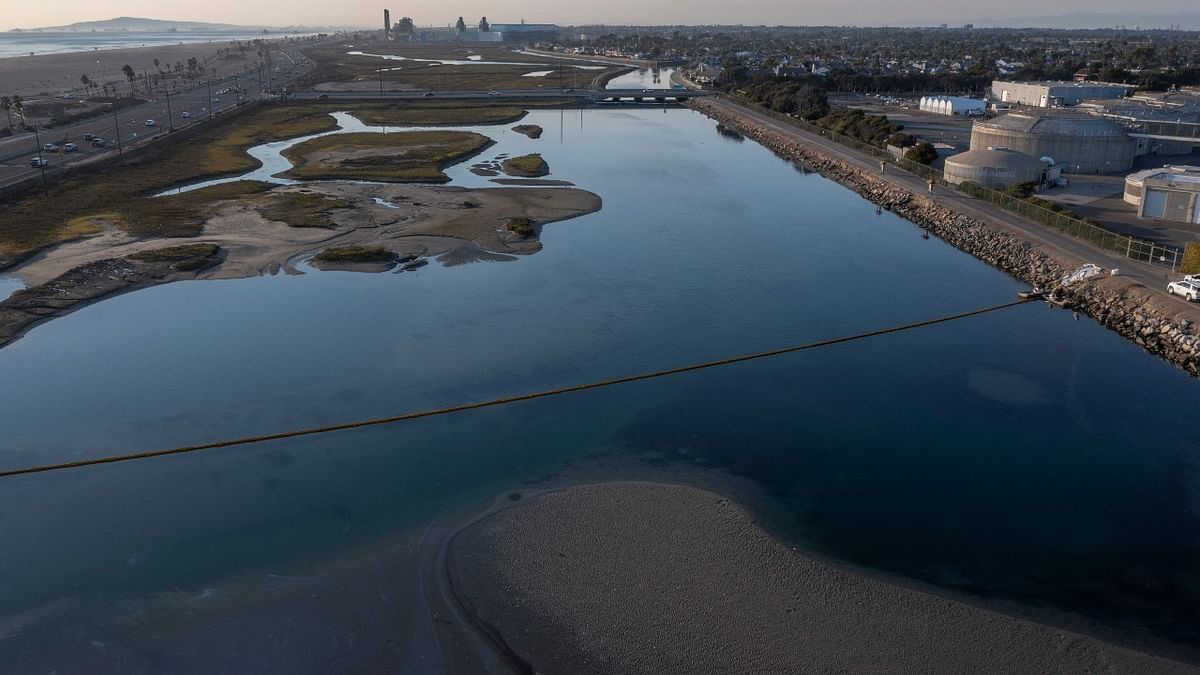 A pipeline failure off the coast of Orange County, California, caused at least 126,000 gallons of oil to spill into the Pacific Ocean, creating a 13-square-mile slick. Dead fish and birds washed ashore in some places as cleanup crews raced to try to contain the spill, which created a slick that extended from Huntington Beach to Newport Beach. Credit: AFP Photo