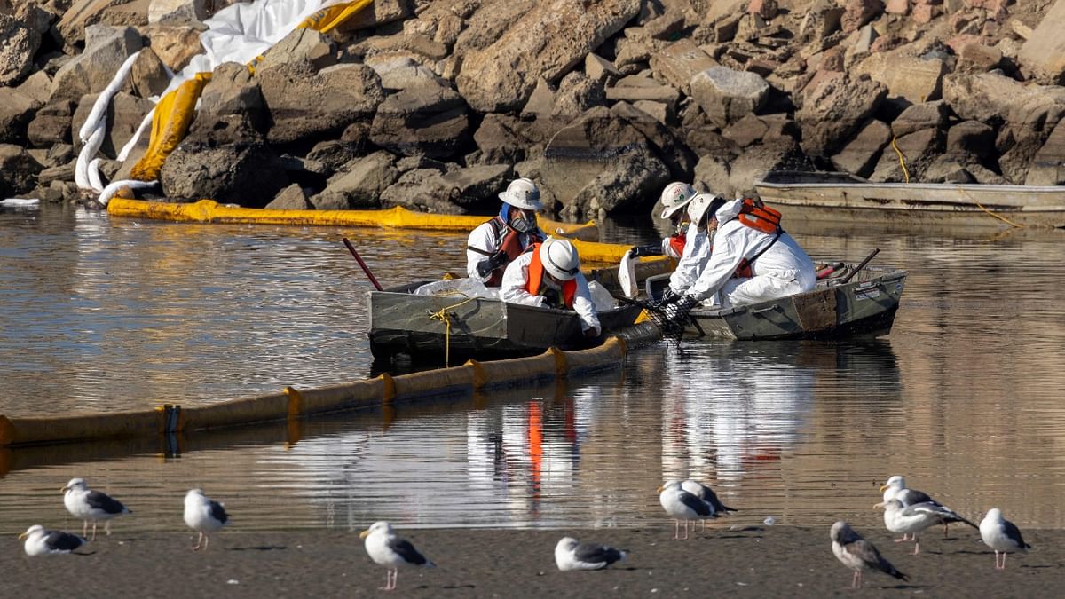 The US Coast Guard said in a statement that crews had “recovered” about 3,150 gallons of oil. Fourteen boats were involved in the cleanup effort, and crews had deployed 5,360 feet of boom, a floating barrier that helps contain oil. Credit: AFP Photo