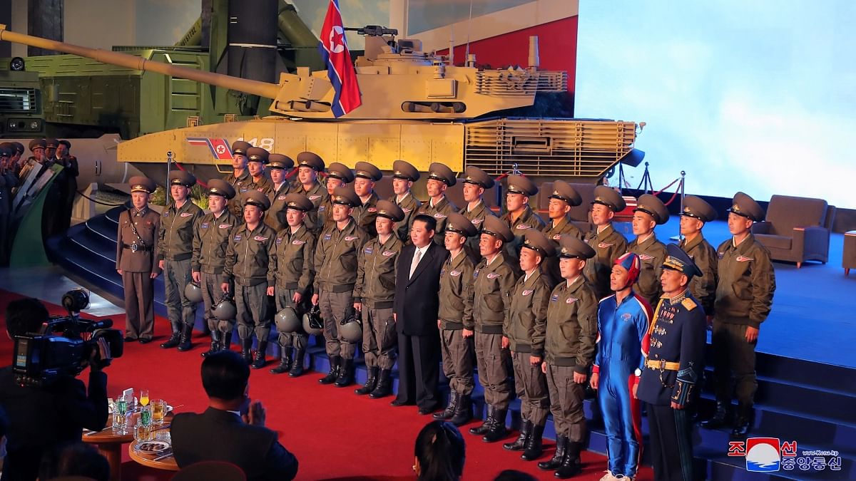 Kim Jong Un poses for a photo with military personnel at the Defence Development Exhibition, in Pyongyang, North Korea. Credit: KCNA via Reuters