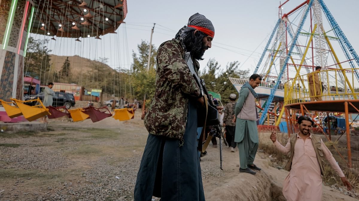 Taliban fighters at the amusement park in Afghanistan. Credit: Reuters Photo