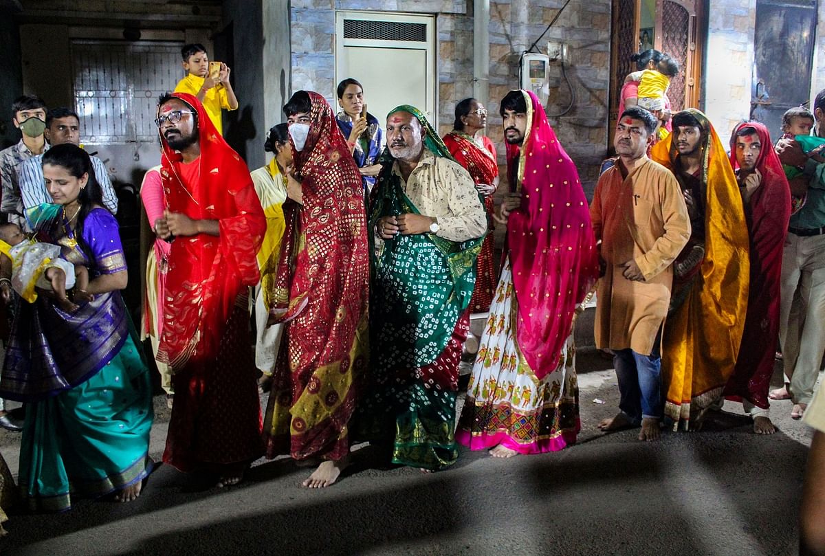 Men cross-dress as they perform garba during last day of 'Navratri' festival in Ahmedabad. Credit: PTI Photo