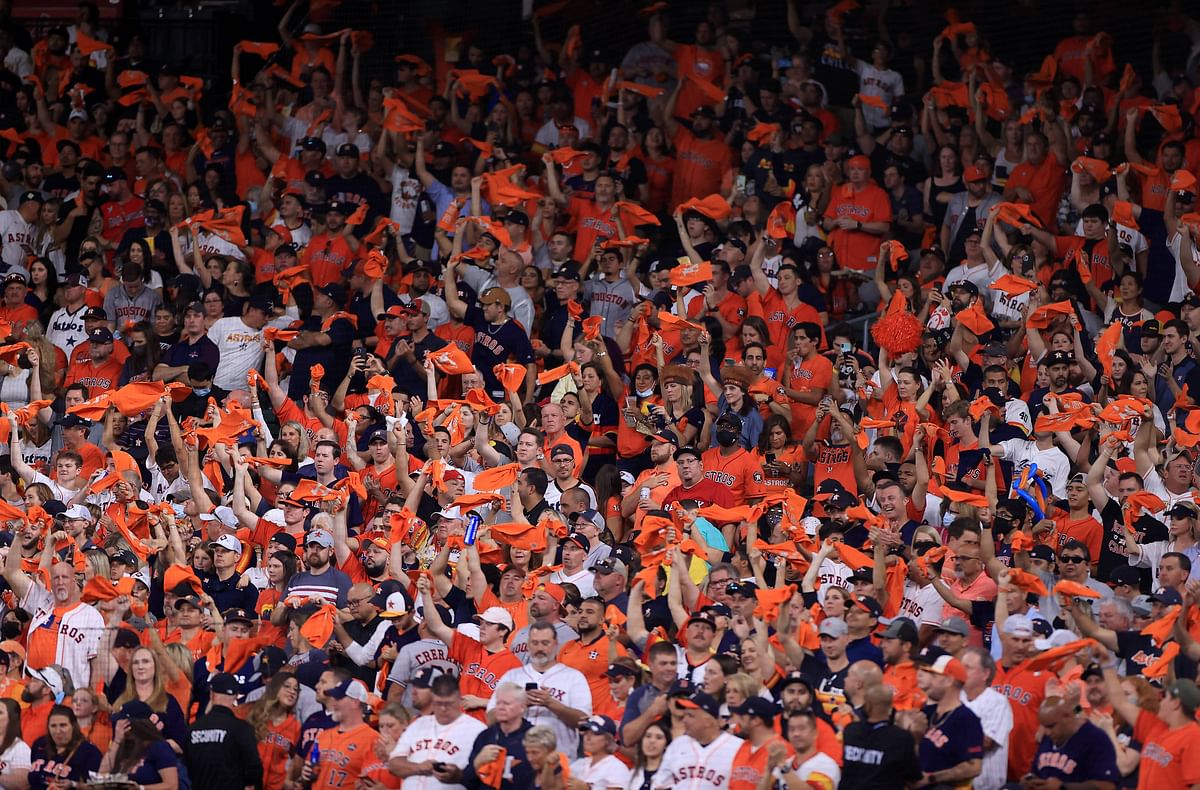Houston Astros fans cheer on their team during the first inning of their game against the Boston Red Sox in Game One of the American League Championship. Credit: AFP Photo