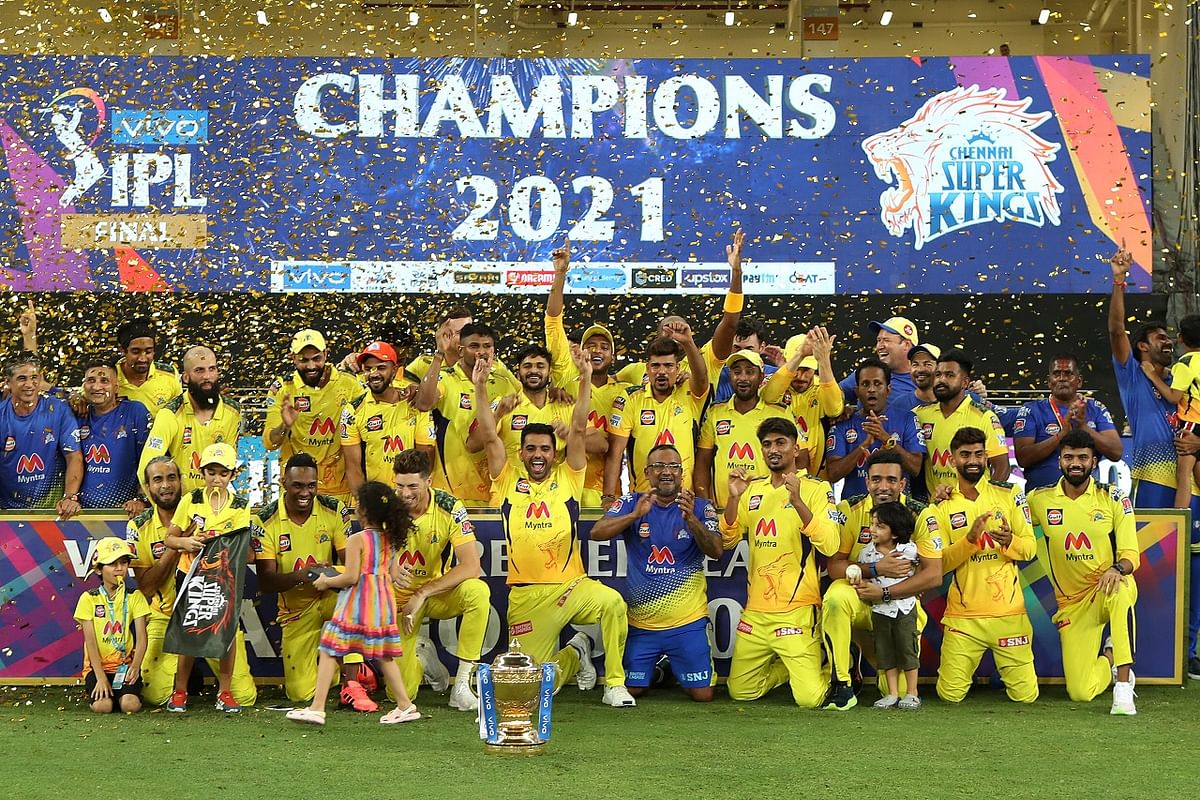 Chennai Super Kings players pose with the IPL trophy after wiining final of the Indian Premier League 2021 between the Chennai Super Kings and the Kolkata Knight Riders. Credit: PTI Photo