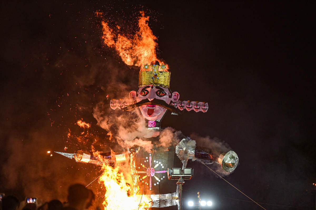 An effigy of 'Ravana' burns during Luv Kush Ramleela as part of Dussehra celebrations at Red Fort Ground in New Delhi. Credit: PTI Photo