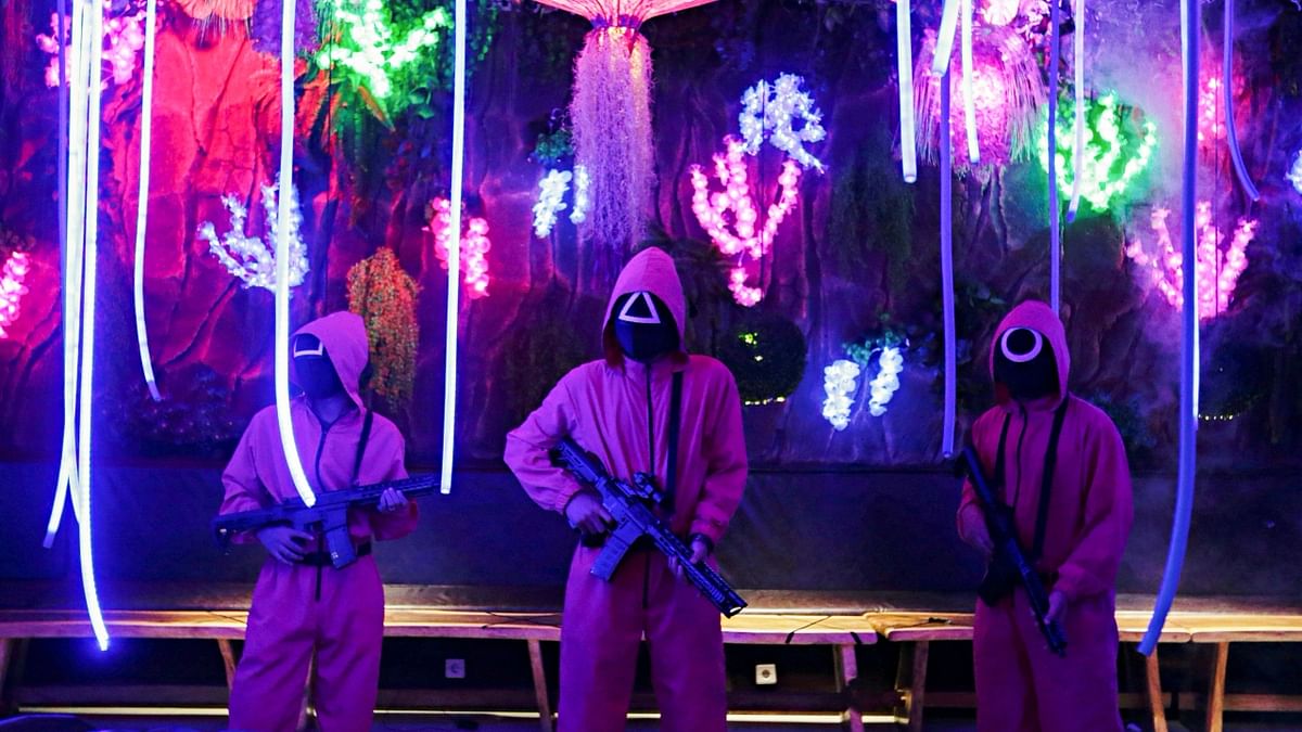 From gatekeepers, guards, servers and other staffs, all are seen dressed in Squid Game costume at the cafe. Credit: Reuters Photo