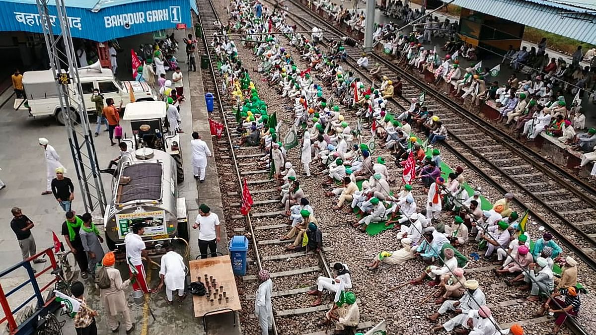 In Rajasthan, farmers held a protest on the tracks in Hanumangarh district and at the entrance of Jaipur Junction station and raised slogans against the central and the Uttar Pradesh governments. Credit: PTI Photo