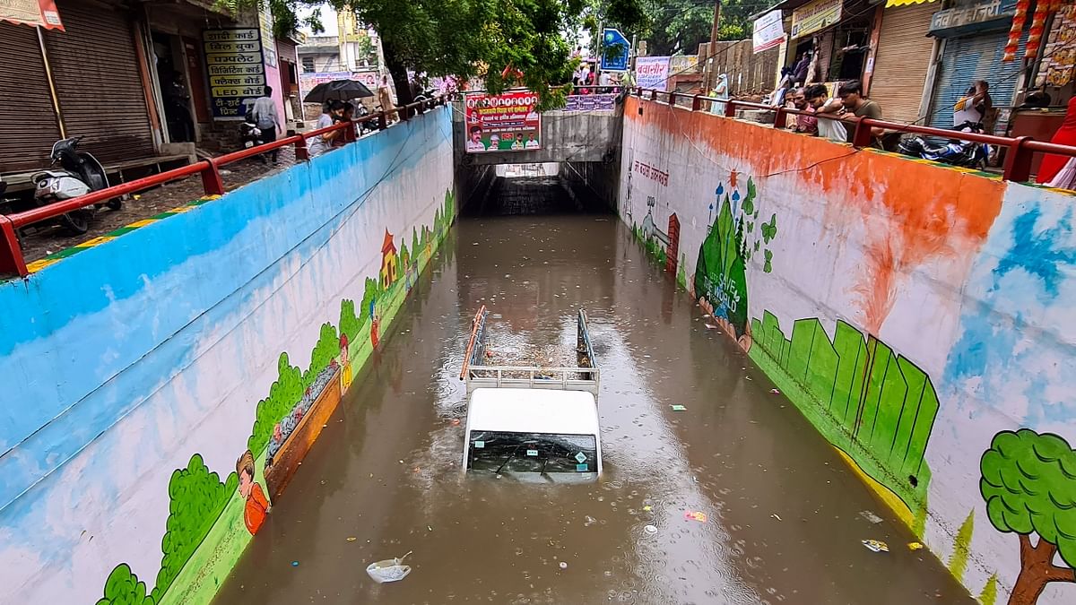 A vehicle stuck in a waterlogged Gaushala underpass due to heavy rain Ghaziabad. Credit: PTI Photo