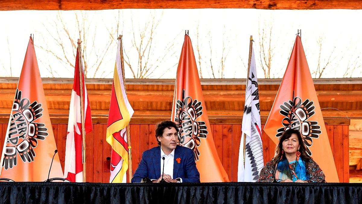 Canada's Prime Minister Justin Trudeau and Kukpi7 Rosanne Casimir speak to the press and Tk'emlups te Secweepemc community members and First Nations leaders at the Tk'emlups Pow wow Arbour in Kamloops. Credit: Reuters Photo