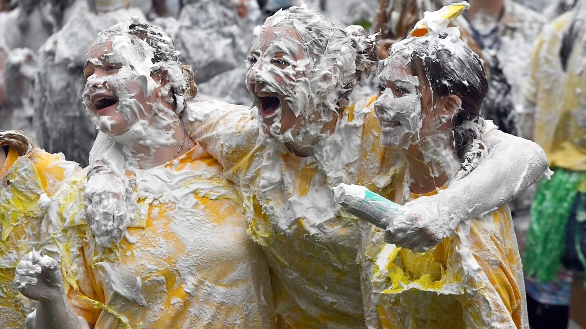Freshers having gala time at the annual Raisin Monday shaving foam fight in the University of St Andrews, Scotland. Credit: AFP Photo