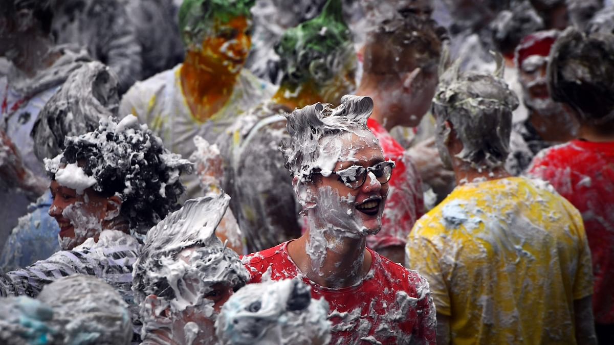 The Raisin Monday costumed foam fight is the culmination of a week of mentoring to welcome first-year students into the 'academic families' as they start their studies at the University of St Andrews. Here are some glimpses from the fun-filled event! Credit: AFP Photo