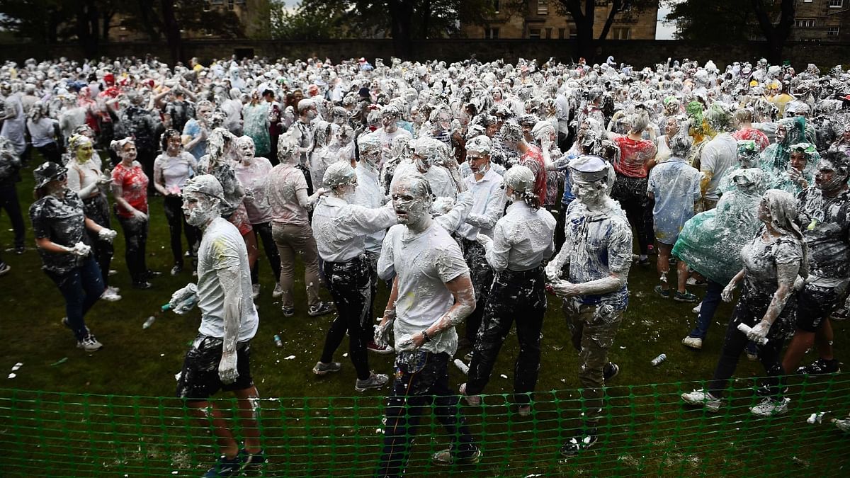 First year students are seen having a ball at the annual Raisin Monday shaving foam fight on the Lower College Lawn in St Andrews, Scotland. Credit: AFP Photo