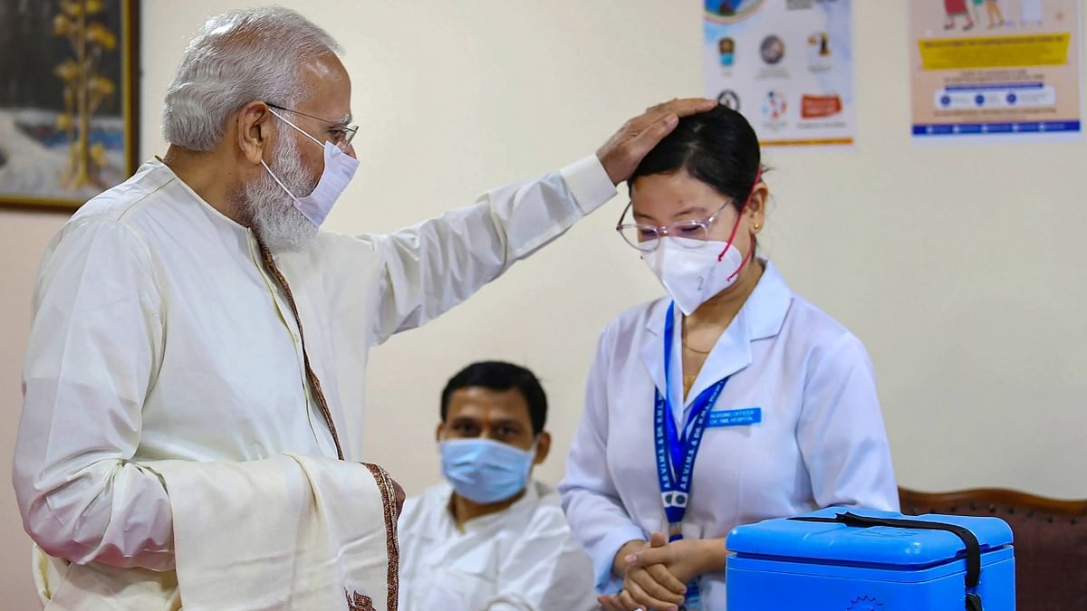 Prime Minister Narendra Modi paid a visit to Ram Manohar Lohia (RML) Hospital in New Delhi as the number of Covid-19 vaccine doses administered in India crossed the 100 crore mark on October 21, 2021. Credit: PIB Photo