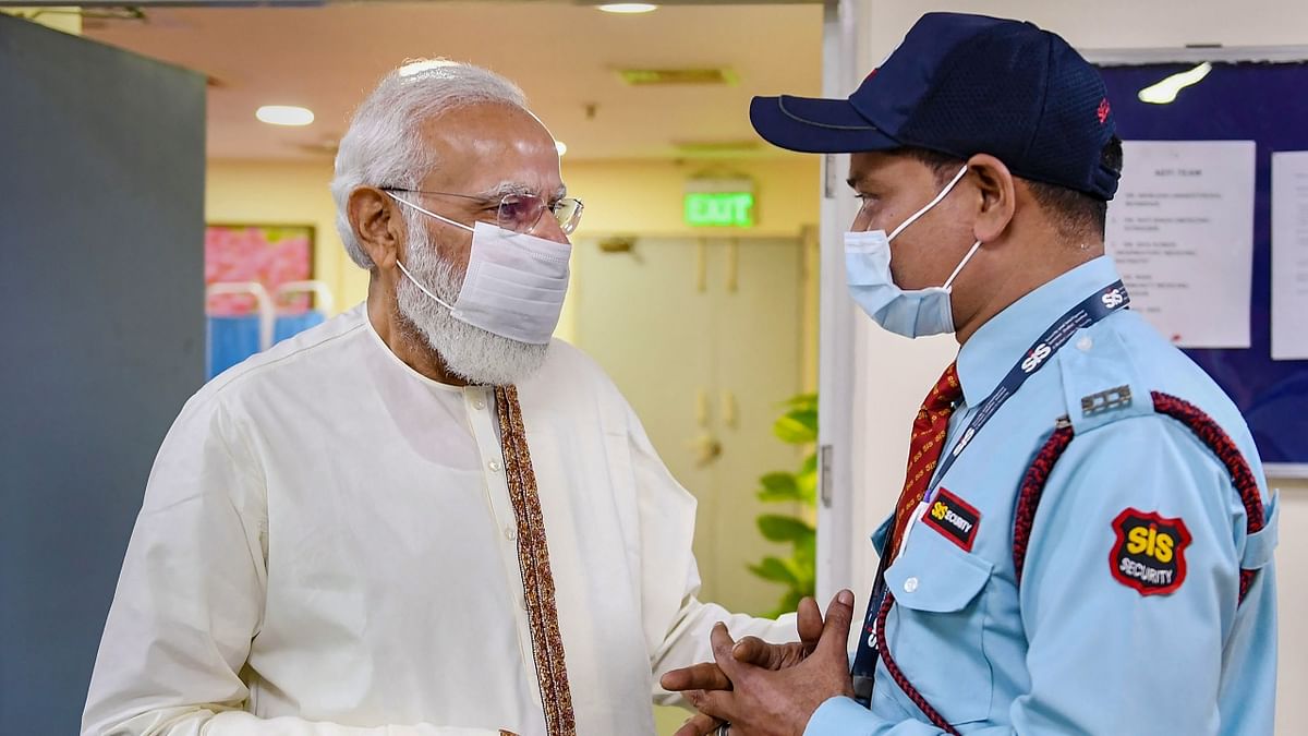 During his visit, Prime Minister Modi held interaction with beneficiaries, healthcare and frontline workers. In this photo, PM Modi is seen interacting with a guard at the hospital. Credit: PIB Photo