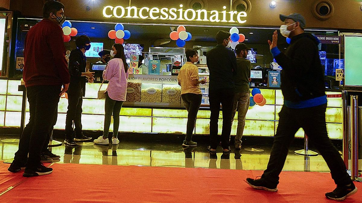 Cinema halls, drama theatres and auditoriums reopened in Maharashtra after several months on Friday with 50 per cent seating capacity and COVID-19 protocols as the second wave of the pandemic appears to be ebbing in the state. These establishments, shut after the second wave hit the state, have reopened just ahead of Diwali in line with the state government's policy to ease coronavirus-related curbs. Credit: AFP Photo