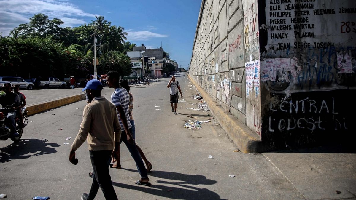 People walk in a street during a general strike and lack of transportation, amid a fuel shortage in Port-au-Prince, Haiti. Credit: AFP Photo
