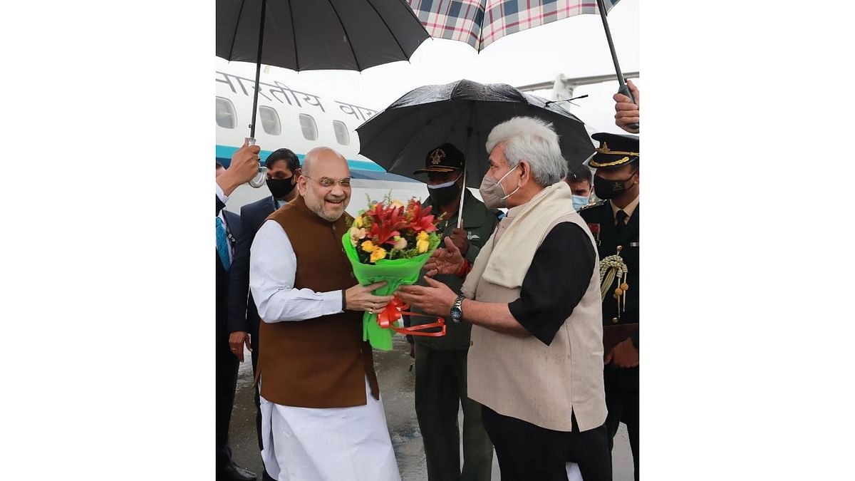 The home minister was received at the technical airport in Jammu by Lt Governor Manoj Sinha and advisor Farooq Khan. Credit: PTI Photo