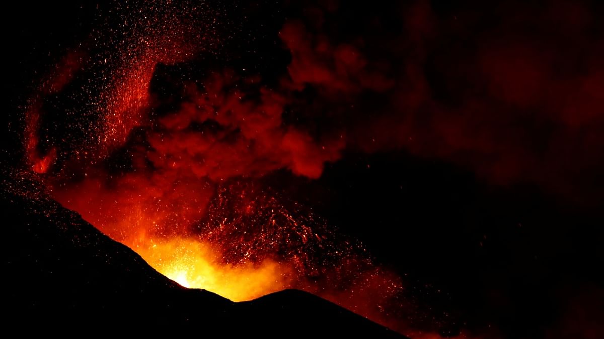 The Cumbre Vieja volcano spews lava and smoke while it continues to erupt, as seen from El Paso, on the Canary Island of La Palma, Spain. Credit: Reuters Photo