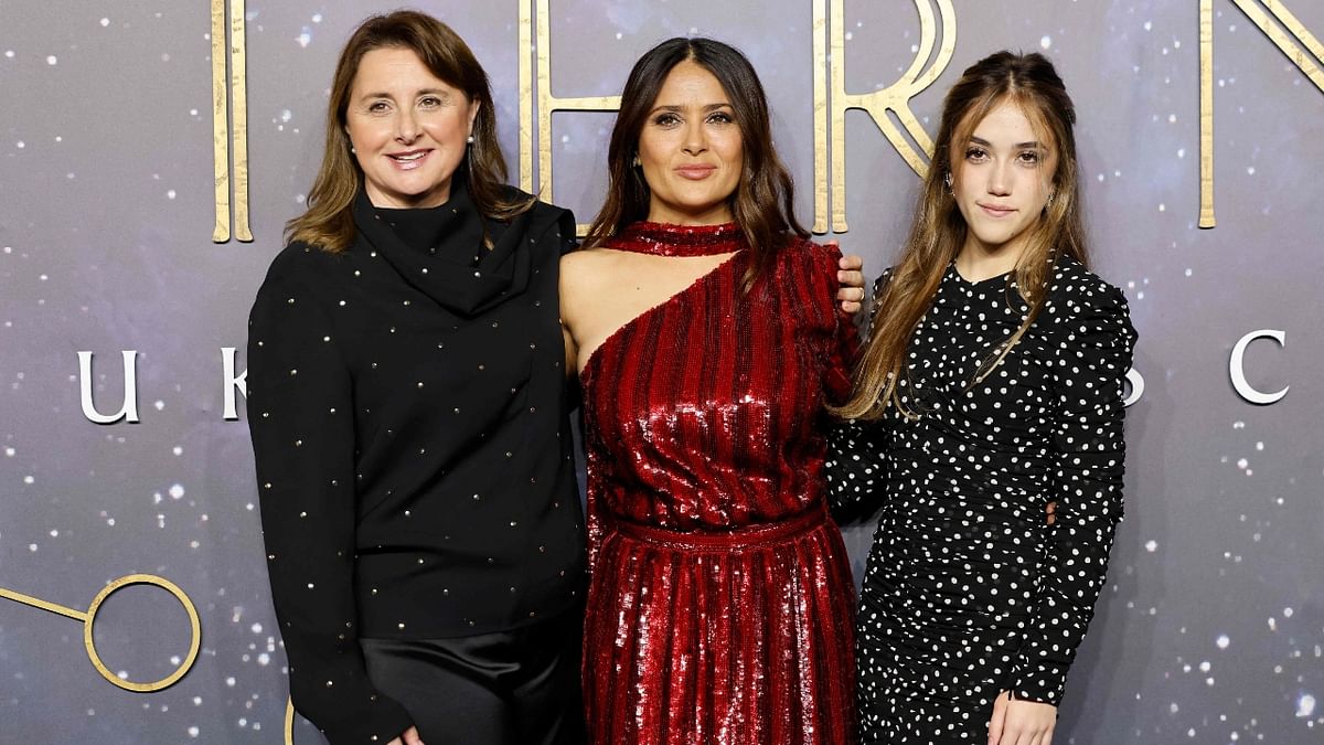 Argentinian film producer Victoria Alonso poses with Mexican-US actor Salma Hayek and her daughter Valentina Paloma Pinault on the blue carpet to attend the UK gala screening of the film 'Eternals'. Credit: AFP Photo