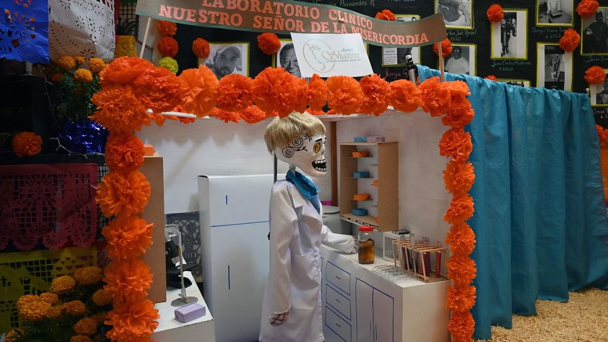 View of decorations in homage of people who died from Covid-19 at a store of wedding dresses in downtown Mexico City. Credit: AFP Photo