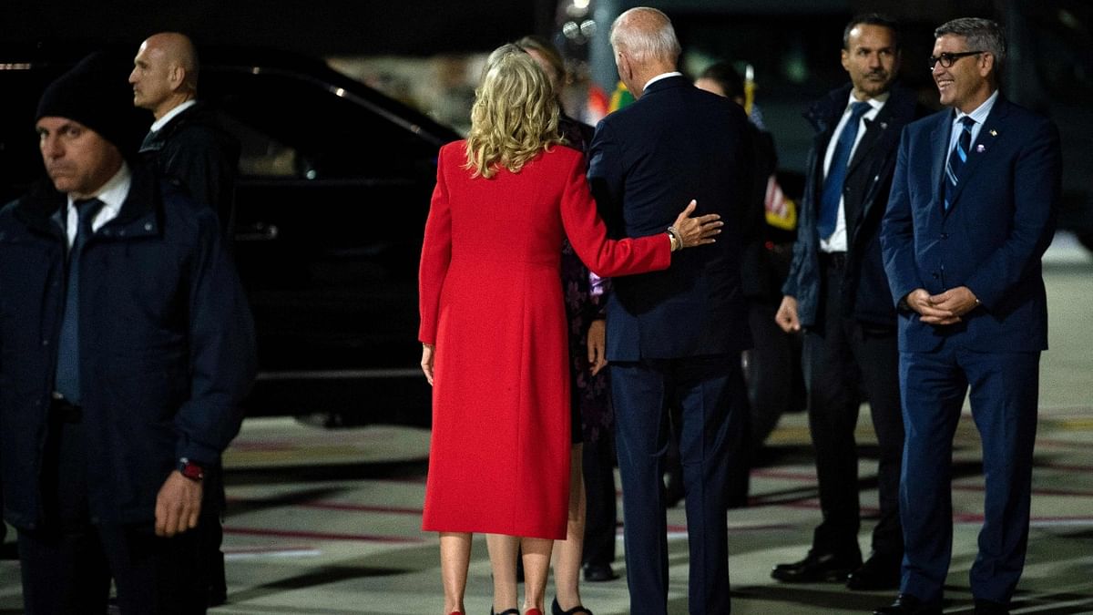 US President Joe Biden (C-R) and US First Lady Jill Biden (C-L) are greeted by officials upon arrival at Rome Fiumicino International Airport. Credit: AFP Photo
