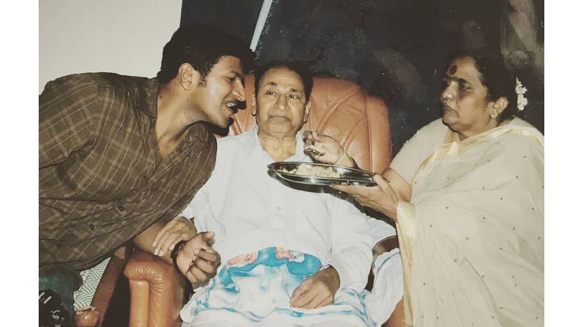 Puneeth Rajkumar with his parents. Credit: Instagram/puneethrajkumar.official