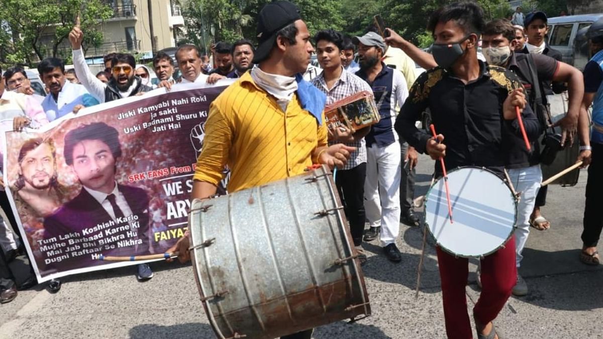 Some admirers began dancing with joy, others waved banners and posters with pictures of the father-son actor duo, followed by a burst of loud fire-crackers. Credit: Pallav Paliwal
