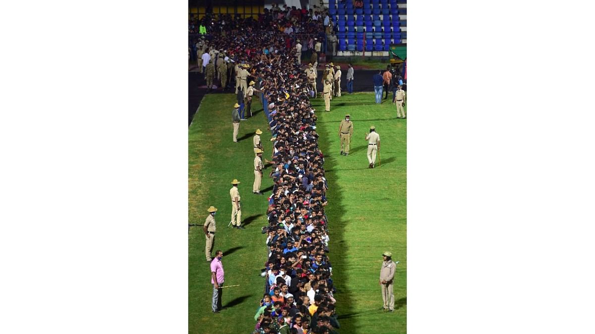 Fans queue up to pay their last respects to the mortal remains of Kannada film actor Puneeth Rajkumar at the Kanteerava Stadium, in Bengaluru. Credit: PTI Photo