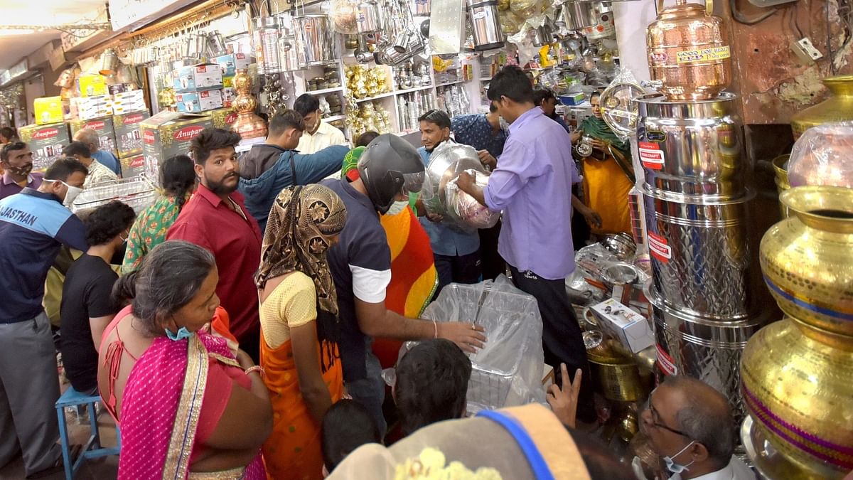 People shop utensils at a market on the occasion of the Dhanteras festival, in Jaipur. Credit: PTI Photo