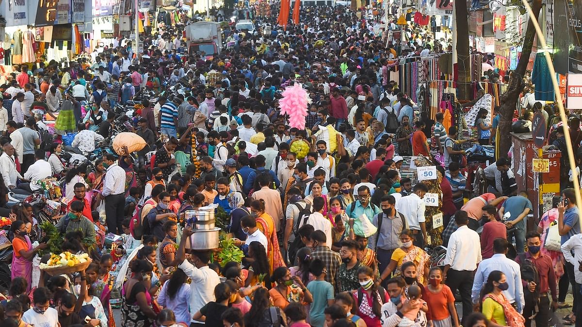 Huge number of crowds are seen at a wholesale flower market ahead of Diwali festival in Kolkata. Credit: PTI Photo