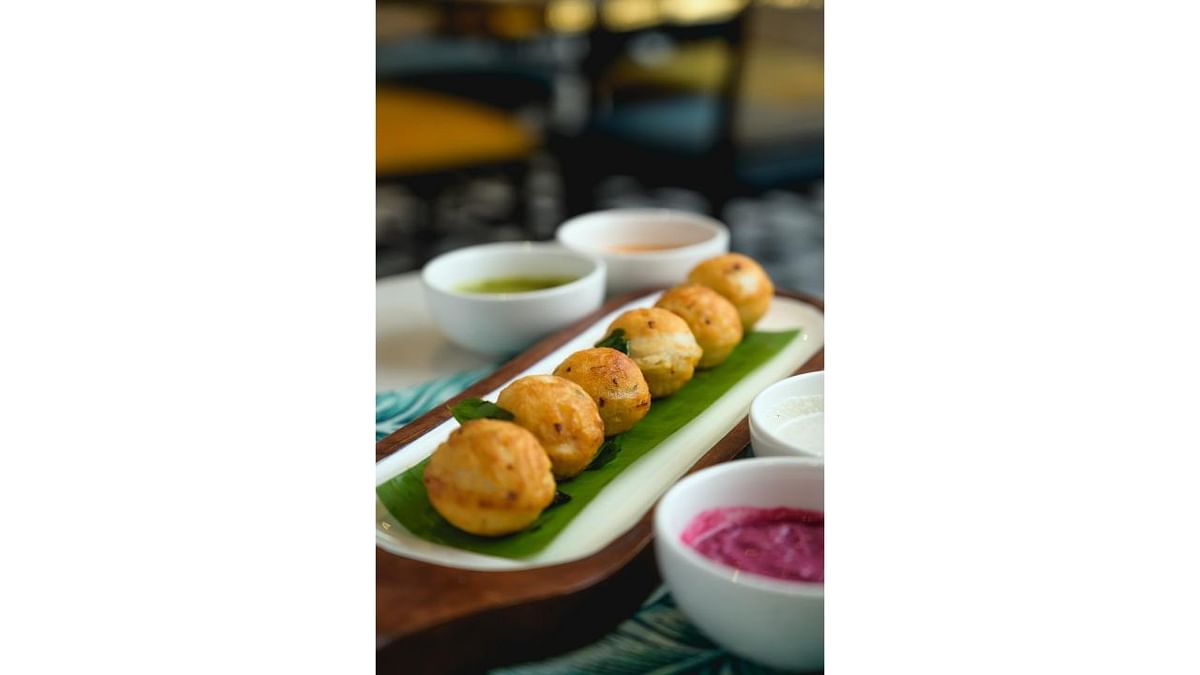 Khuzi Paniyaram: A common dish in the south now finding its well-deserved limelight. No one ever said no to this shallow fried delight made with idli batter and tempered onions and green chillies served with chutneys. Credit: Special Arrangement