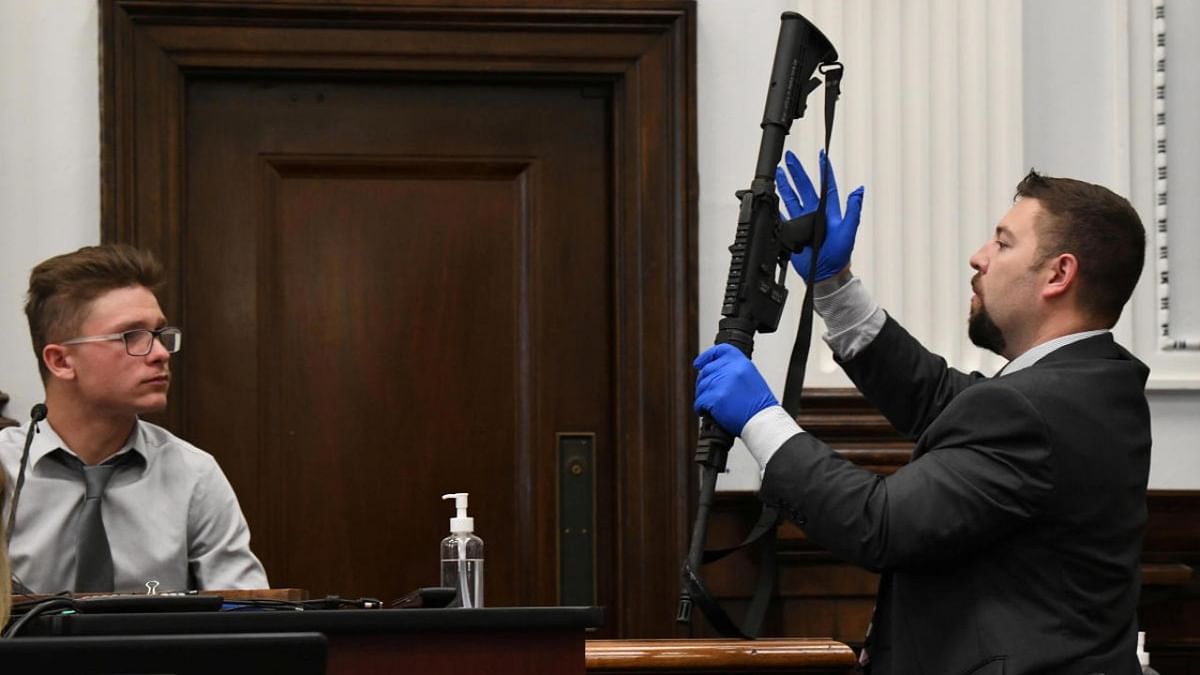 Kenosha Police detective Ben Antaramian shows Dominick Black the rifle Black bought for Kyle Rittenhouse as he was underage, on the first day of Rittenhouse's trial in Kenosha (Wisconsin) Circuit Court in Kenosha. Credit: Reuters photo