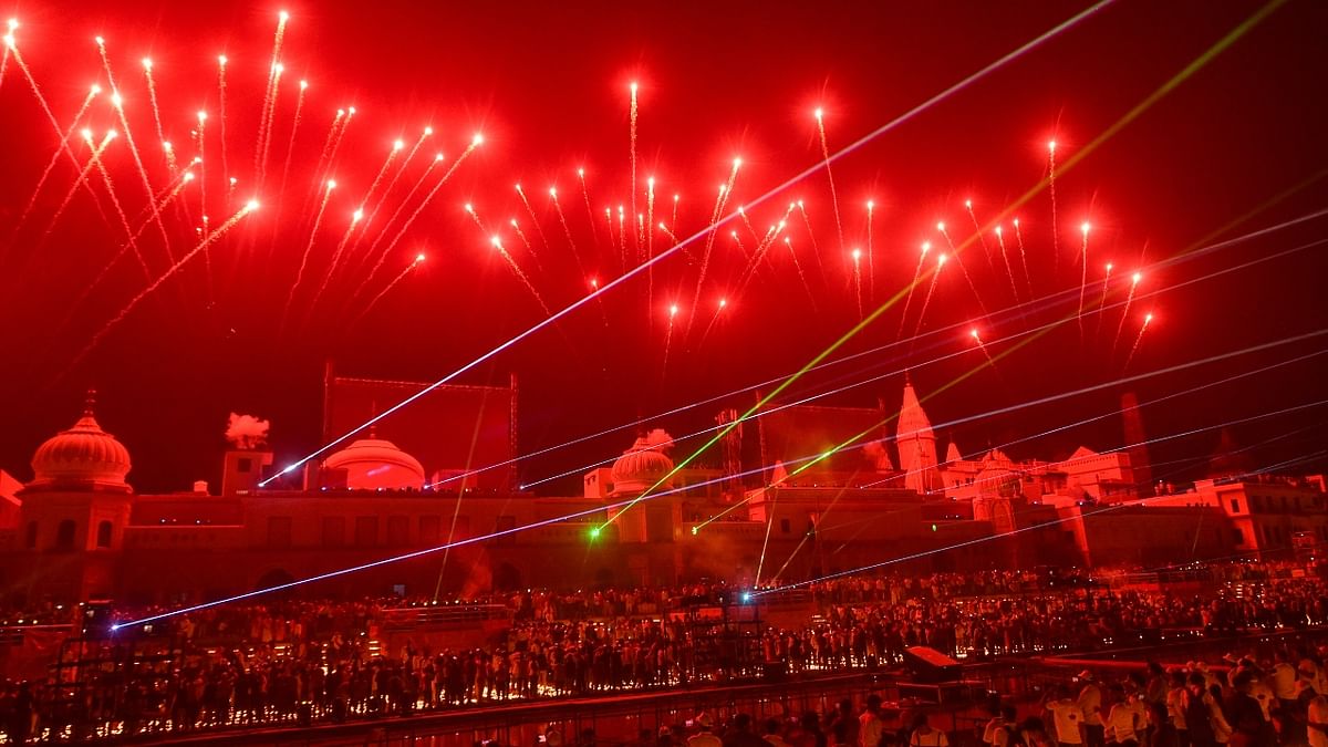 Devotees witness laser show on the bank of Saryu River during Deepotsav celebrations in Ayodhya. Credit: PTI Photo