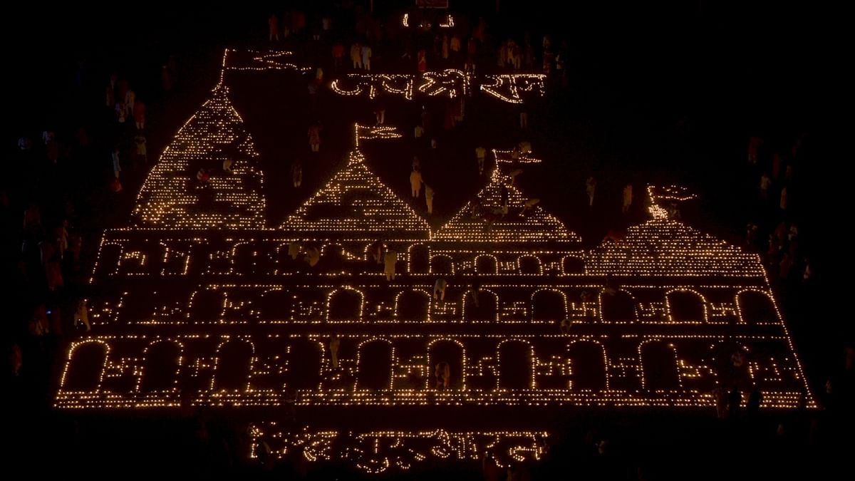 A replica of Ayodhya's Ram Temple made with 15 thousand clay lamps by RSS on the occasion of Diwali festival at Kharghar in Navi Mumbai. Credit: PTI Photo