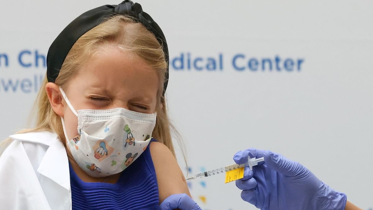 A young girl is clicked receiving the Pfizer-BioNTech Covid-19 vaccine at Cohen Children's Medical Center in New Hyde Park, New York. Credit: Reuters Photo