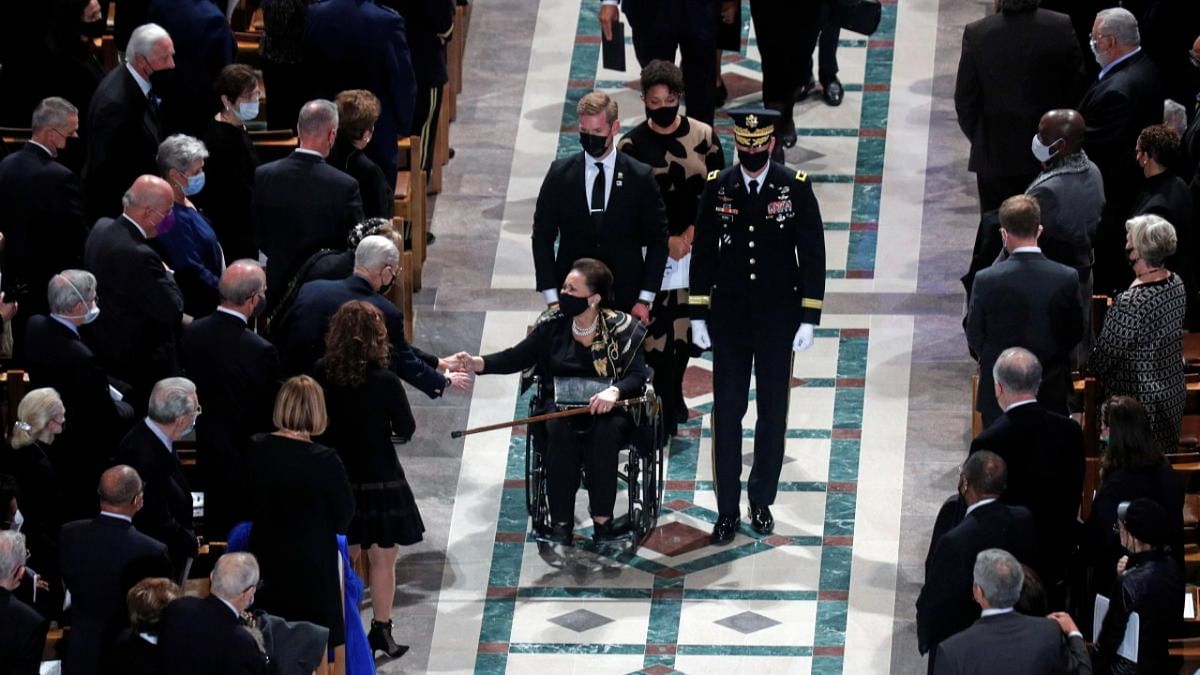 Alma Powell, wife of late former US Secretary of State Colin Powell, is escorted after a memorial service at Washington National Cathedral in Washington. Credit: Reuters photo