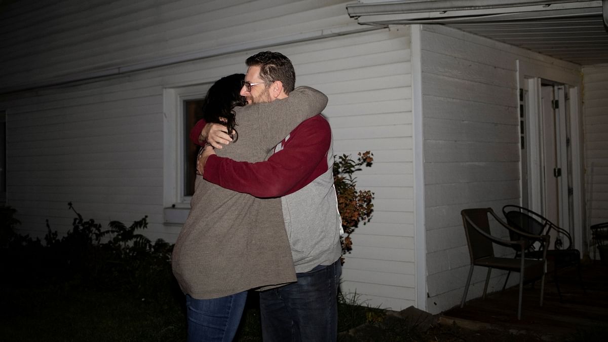 Janet Simoni embraces her husband Lincoln at his home after the US reopened its land borders to fully vaccinated travellers for the first time since coronavirus disease (COVID-19) restrictions were imposed, in Keego Harbor, Michigan, US. Credit: Reuters Photo