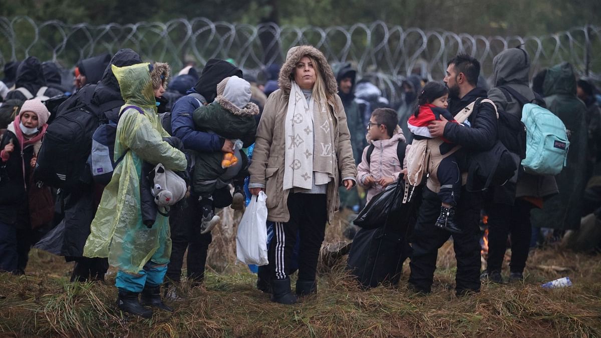 Migrants from the Middle East and elsewhere gather at the Belarus-Poland border near Grodno, Belarus. Credit: AP/PTI Photo