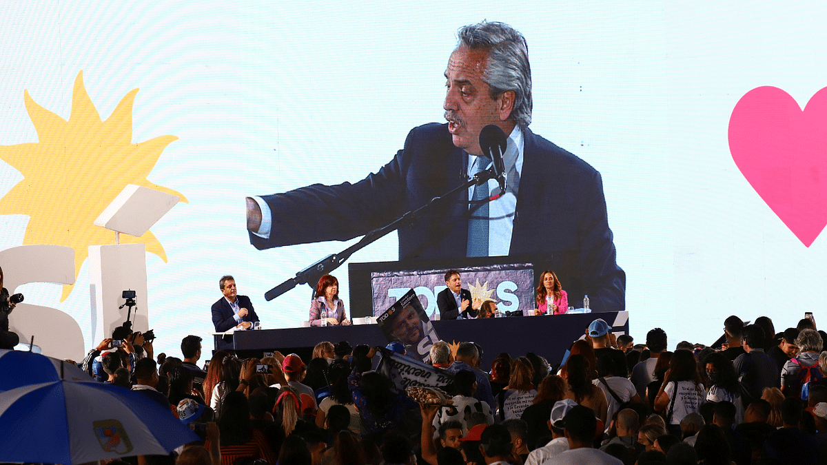 Argentina's President Alberto Fernandez is projected on a screen on stage as he heads the closing campaign rally before midterm elections, in Merlo, Buenos Aires, Argentina. Credit: Reuters Photo