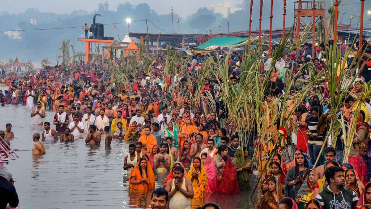 Devotees gather in large numbers to perform rituals on the banks of the Narmada river during Chhath Puja, in Jabalpur. Credit: PTI Photo