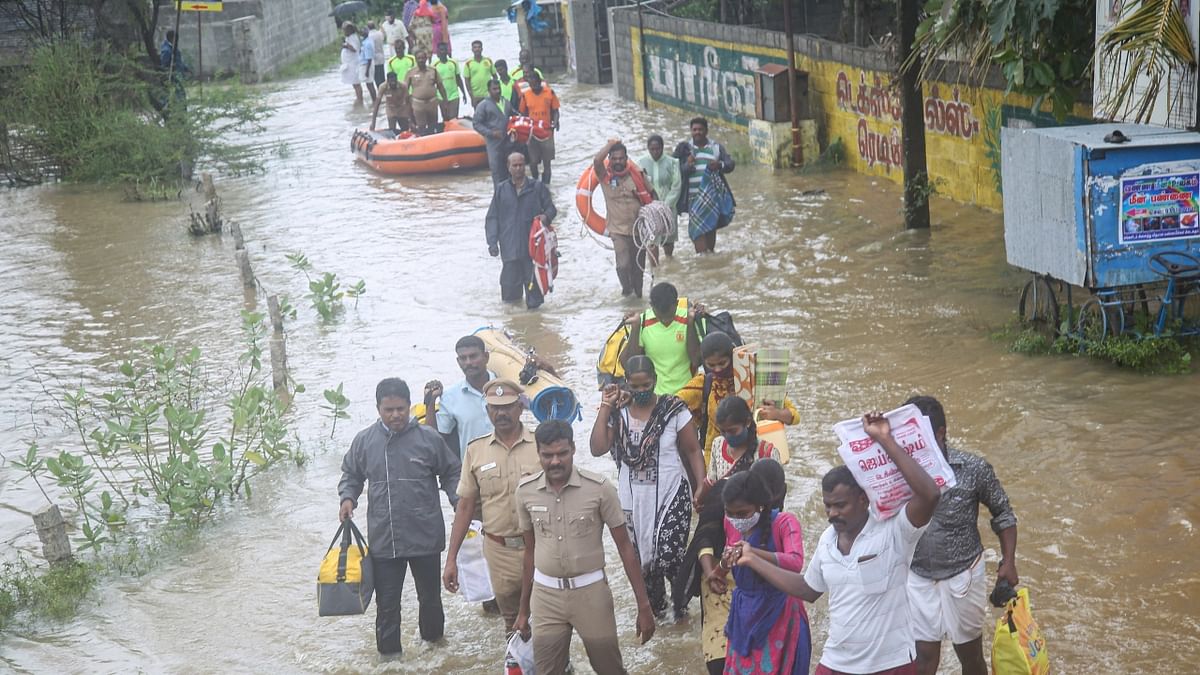 College students being rescued from their hostel after flooding in the area following heavy rains, in Kanyakumari. Credit: PTI Photo