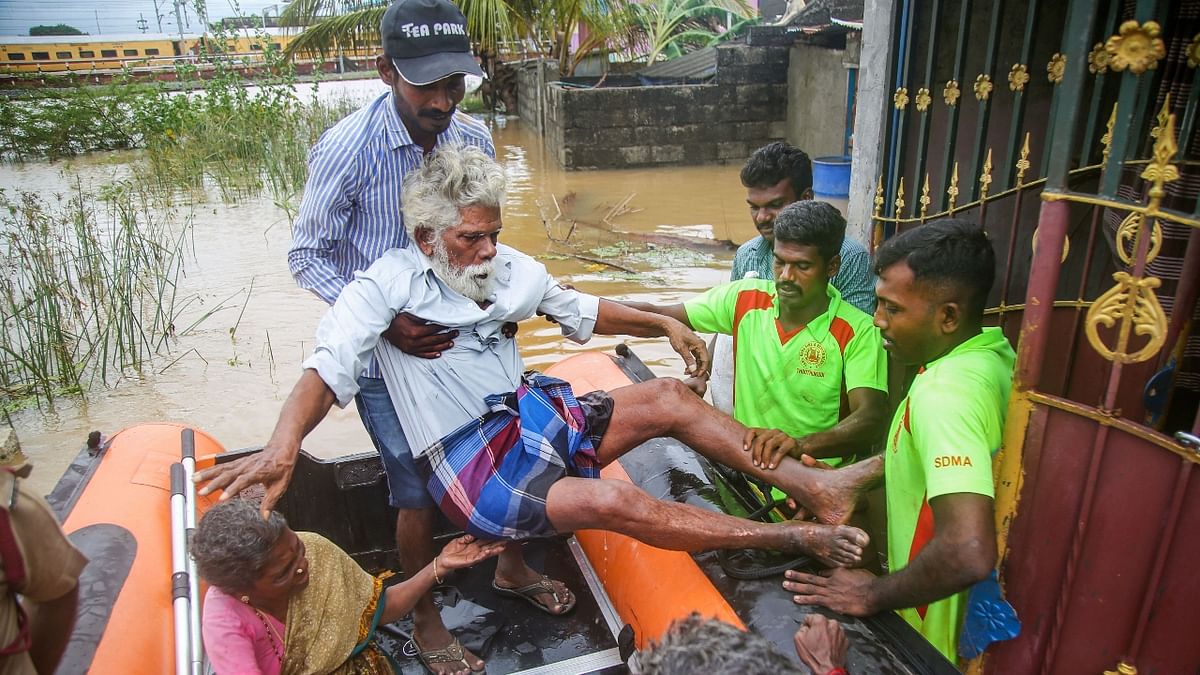 Nagercoil Municipal Corporation personnel carry out rescue operations after flooding in the Oottuvazmadam area near Nagercoil, in Kanyakumari. Credit: PTI Photo