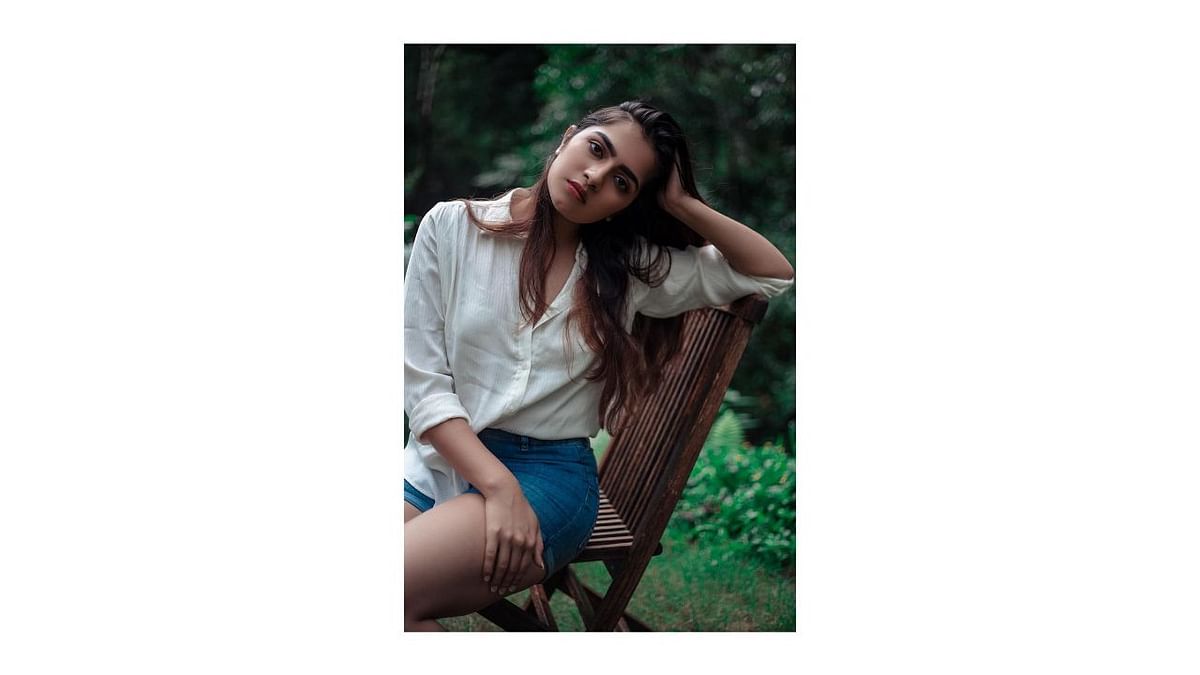 Rukmini aces her fashion game in a shirt paired with denim shorts. Credit: Instagram/rukmini_vasanth