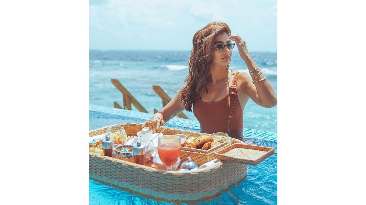 Pooja enjoying a floating breakfast in Maldives. Credit: Instagram/hegdepooja