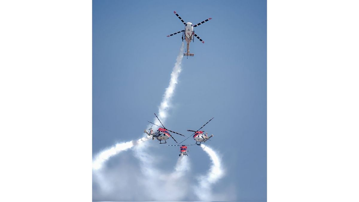 Indian Air Force's Sarang aerobatics team display their skills during Dubai Airshow. Credit: Twitter/@IAF_MCC