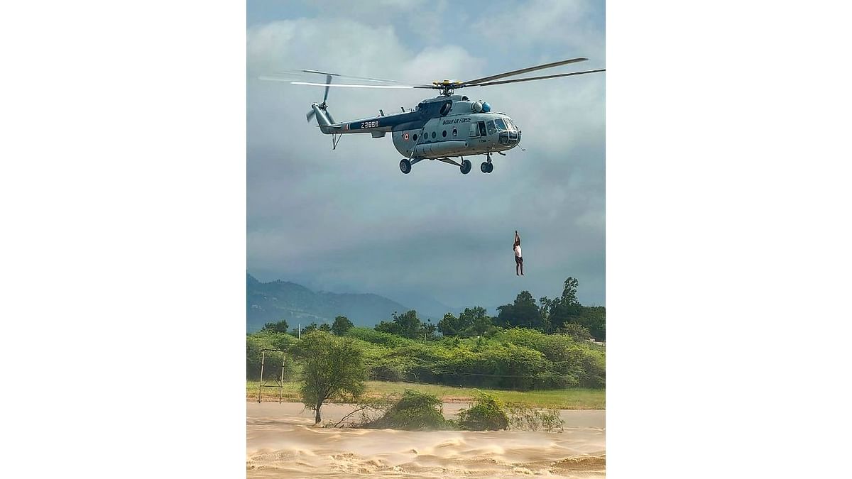 NDRF team evacuates the people stranded in the swollen Chitravathi river, near Veldurthi village in Anantapur, Andhra Pradesh. Credit: PTI Photo