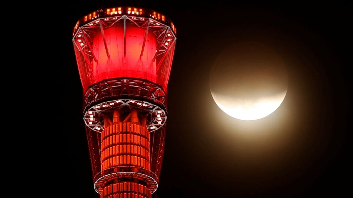 A shadow falls on the moon, as seen beside the world's tallest broadcasting tower Tokyo Skytree, during a partial lunar eclipse in Tokyo. Credit: Reuters Photo
