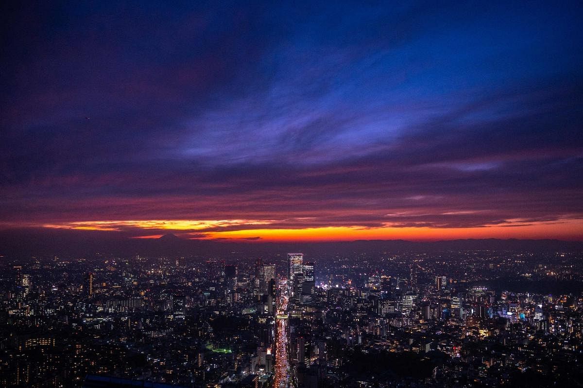 The city skyline is seen in the evening from the observation deck of Roppongi Hills in Tokyo. Credit: AFP Photo