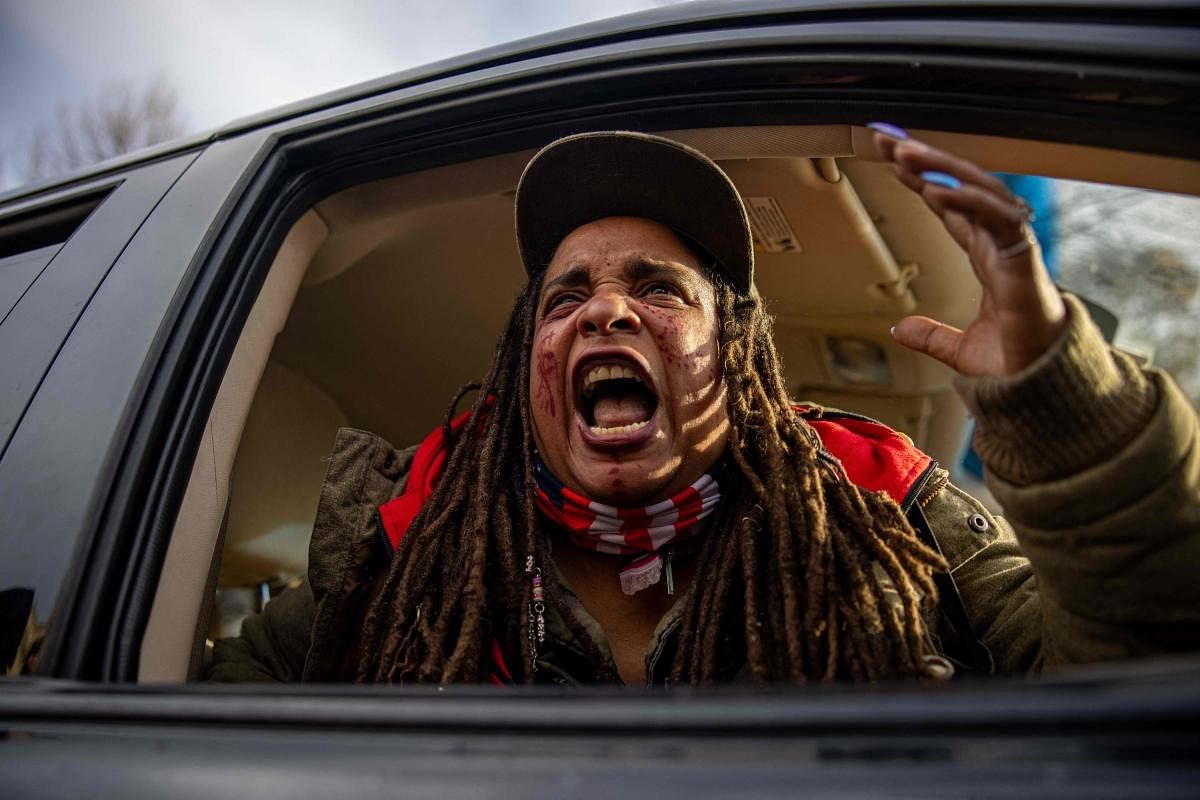 A woman reacts, in anger, to the Kyle Rittenhouse verdict outside the courthouse in Kenosha, Wisconsin. Rittenhouse, the American teenager who shot dead two men during protests and riots against police brutality in Wisconsin last year, was acquitted of all charges on Friday. Credit: AFP Photo