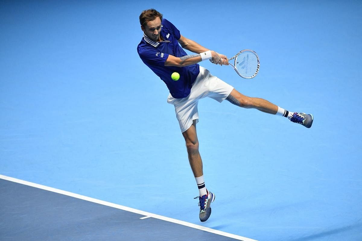 Russia's Daniil Medvedev returns a shot to Norway's Casper Ruud during their semi-final match of the ATP Finals at the Pala Alpitour venue in Turin. Credit: AFP Photo